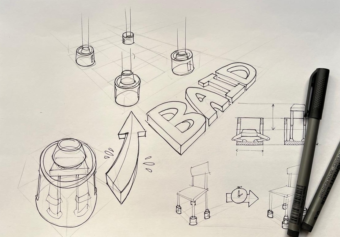 Early hand-drawn BAID concept sketches of the chair-leg device